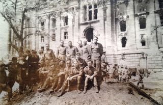 In front of the ruins of the Reichstag